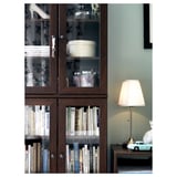 A stylish modern lamp named ÅRSTID, featuring a beige polyester shade, a metallic base, diffused lighting, and a classic design.