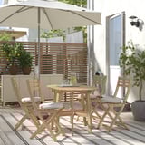 ASKHOLMEN outdoor dining set with 4 chairs, wooden table & beige cushions.