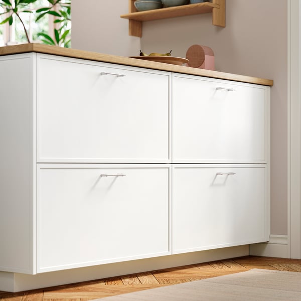 Modern white kitchen cabinet with thin frames and subtle hardware for minimalist style.