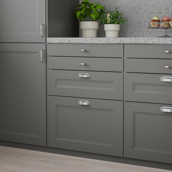 Modern kitchen with grey AXSTAD drawers. Dark grey, sleek, fits both styles. Medium-sized drawers.