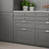 Modern kitchen with grey AXSTAD drawers. Dark grey, sleek, fits both styles. Medium-sized drawers.
