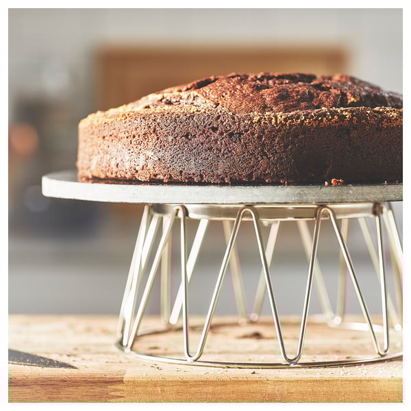 Rotating marble cake stand with decorating access