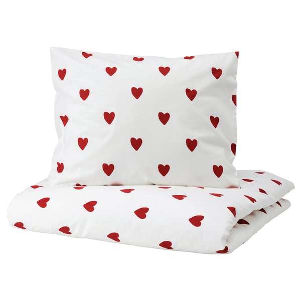 Heart-patterned white duvet and pillow set. Red hearts, soft cotton, zipper closure.