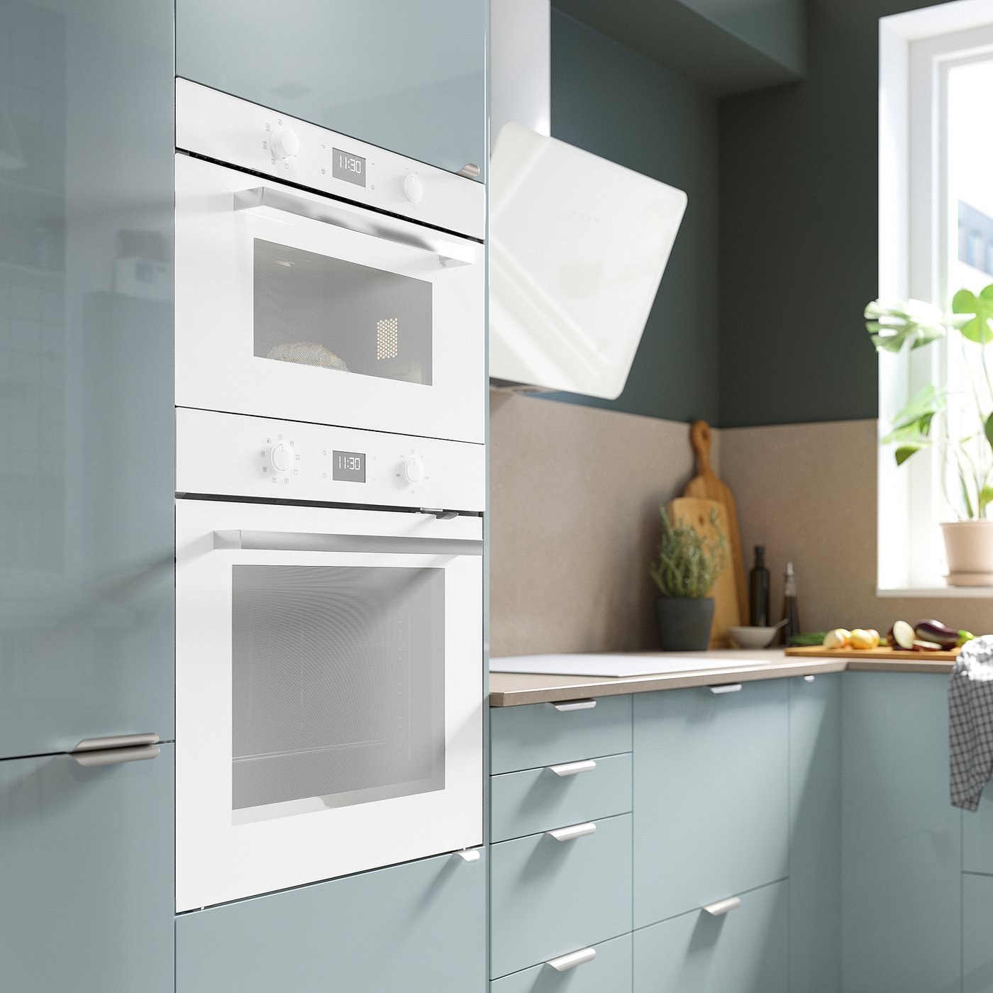 Modern kitchen with white built-in microwave, oven, and sleek blue cabinets.