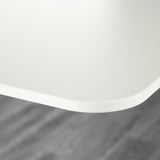 White table edge, smooth & rounded.