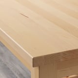 Smooth, light birch wood tabletop, seamless finish, sturdy craftsmanship.