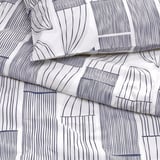 Patterned duvet cover set with abstract leaf prints, crisp percale fabric, and cool touch.