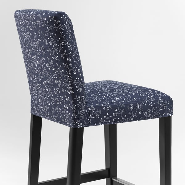 A stylish blue floral-patterned bar stool with a black metal frame. Comfortable, washable, and designed for durability.