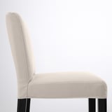 Modern beige bar stool with tall back, cushioned seat, and black legs. Comfortable, washable fabric.