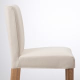 Chair with beige upholstered seat and back, wooden legs, high-quality fabric, comfortable and sturdy.