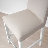 Modern white bar stool with cushioned seat and back, designed for comfort and easy cleaning.