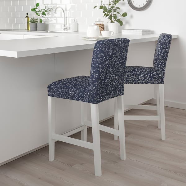 Two blue floral stools beside kitchen island.