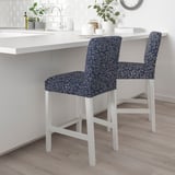 Two blue floral stools beside kitchen island.