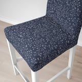 Modern bar stool with dark gray floral cover, white frame. Comfortable, stylish, and removable for easy washing.