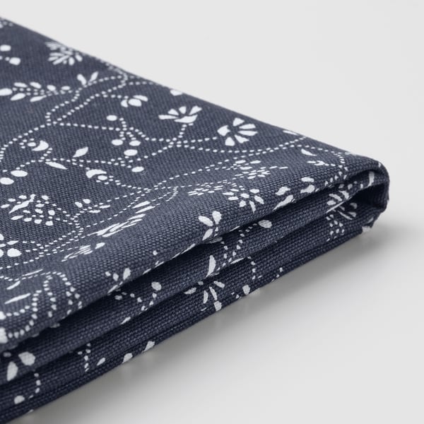 It shows a navy blue, patterned fabric with small white floral designs, likely part of the BERGMUND series, highlighting its quality and texture.