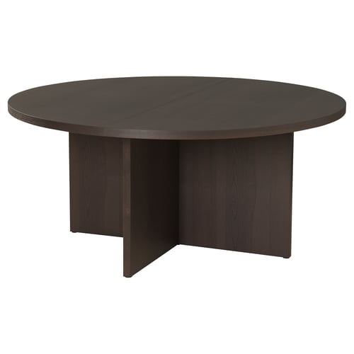 A BERGSHYTTAN dining table. Its round, black, made of wood veneer, and a simple, modern design with adjustable feet.