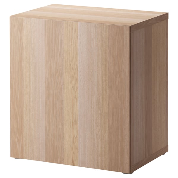 Light wood square BESTÅ storage unit with a single door.