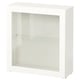 A white BESTÅ cabinet with one clear glass shelf and door, featuring a modern design.