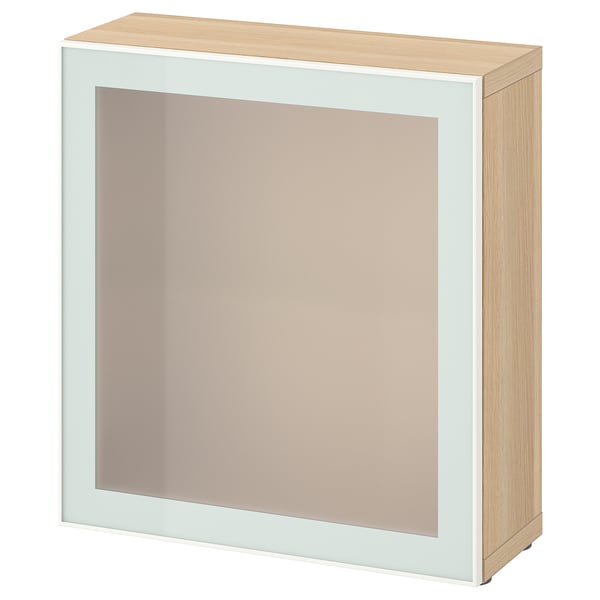 Ikea BESTÅ: light wood cabinet with frosted glass door, rectangular, modern design.