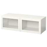 A white BESTÅ storage unit with glass doors. It a rectangular shape and sleek design.