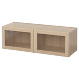 A light wooden BESTÅ storage unit with two open compartments on a plain white background.