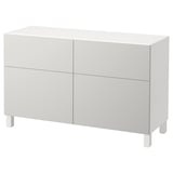 White BESTÅ sideboard, four doors, sleek rectangular design with adjustable shelves.