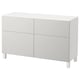 A white BESTÅ cabinet with four doors and two drawers, featuring a sleek and minimalist design.