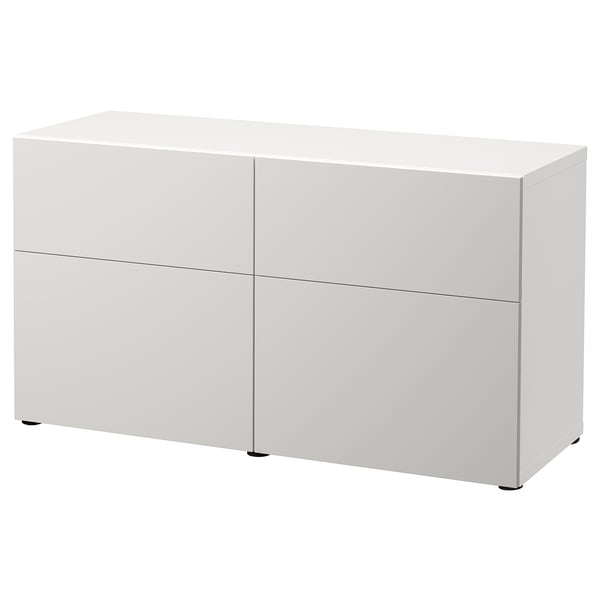 A BESTÅ white sideboard with two sections and four compartments, featuring sleek, modern design and integrated push-openers.