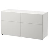 A BESTÅ white sideboard with two sections and four compartments, featuring sleek, modern design and integrated push-openers.