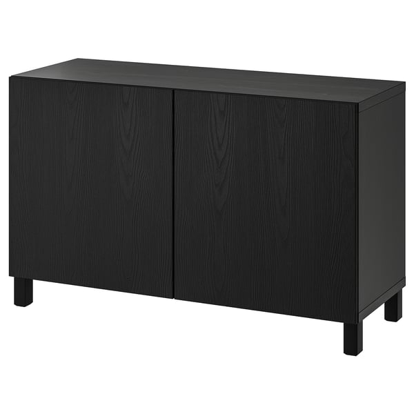 Modern black BESTÅ sideboard with two doors, rectangular shape, dark wood grain pattern, adjustable shelves, soft closing doors.