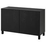 Modern black BESTÅ sideboard with two doors, rectangular shape, dark wood grain pattern, adjustable shelves, soft closing doors.