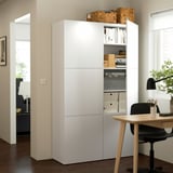BESTÅ storage unit with adjustable shelves and soft close doors in home office.