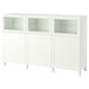 A white BESTÅ sideboard with glass doors for display and storage.