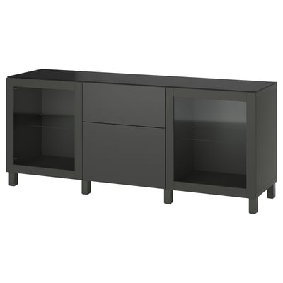 Black BESTÅ sideboard, storing items with display shelves. Modern, minimalist design with dark feet.