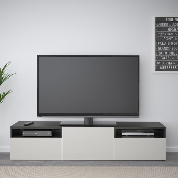 Modern living room with BESTÅ tv bench and flat-screen tv.