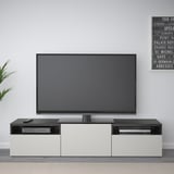 Modern living room with BESTÅ tv bench and flat-screen tv.