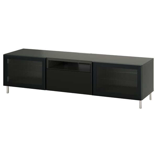 Modern black BESTÅ tv stand, rectangular with glass doors and drawers, sleek metal legs.
