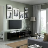Modern living room with BESTÅ tv bench, books, vase, neat cables, silent drawers.