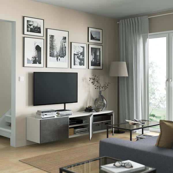 Modern living room with a BESTÅ tv bench featuring adjustable shelves, cable management, soft-close hinges, and a sleek, wall-mounted design.