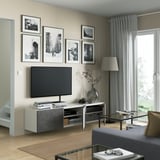 Modern living room with a BESTÅ tv bench featuring adjustable shelves, cable management, soft-close hinges, and a sleek, wall-mounted design.