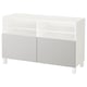 A BESTÅ tv bench in white with grey lower sections and rectangular legs. It has open shelves at the top for storage.