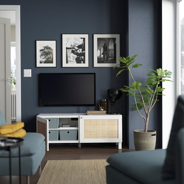 Modern grey living room with BESTÅ tv unit, art prints, and blue seating.