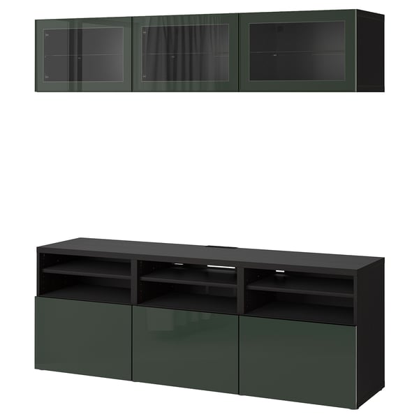 Modern dark green BESTÅ tv unit with wall cabinets. Glass doors display items, with hidden compartments for storage.