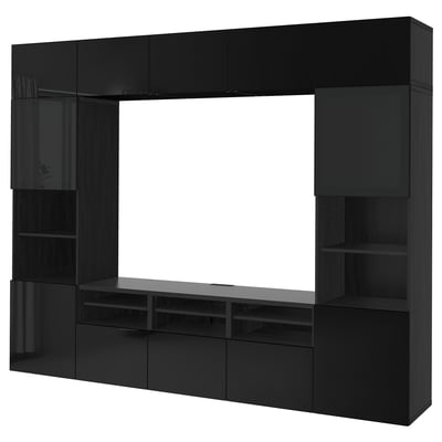 A black BESTÅ tv storage unit with shelves and cabinets.