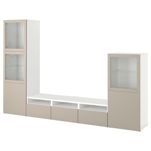BESTÅ tv unit in beige and white. Modern design with drawers, shelves, and glass doors for storage.