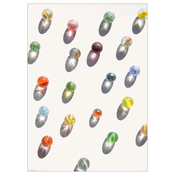 Colorful marbles inside transparent ovoids on white background; artistic print.