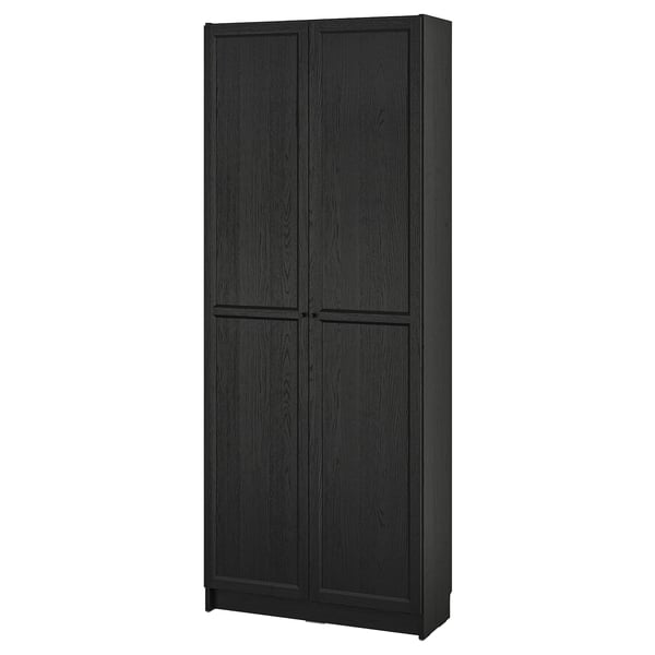 Black BILLY bookcase, sleek design. Tall, rectangular with adjustable shelves. Dark wood finish, closed doors.