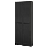 Black BILLY bookcase, sleek design. Tall, rectangular with adjustable shelves. Dark wood finish, closed doors.