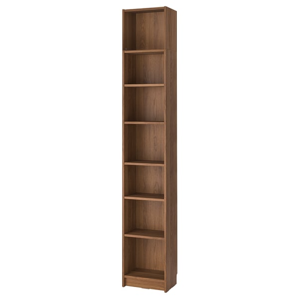 A tall, wooden BILLY bookcase in a light brown color, featuring open shelves for storage.