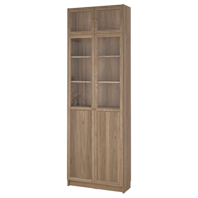 A BILLY bookcase with glass doors, 4 adjustable, 2 fixed shelves. Modern wooden design.